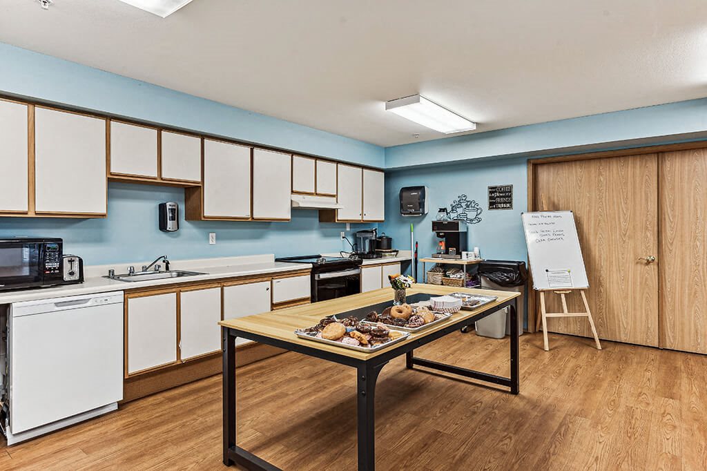 Social lounge kitchen at Woodrose Senior Affordable Apartments in Bellingham WA